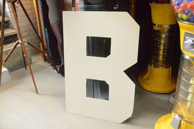 "B" to make "Bollywood". To rent with the letters "Hollywood"